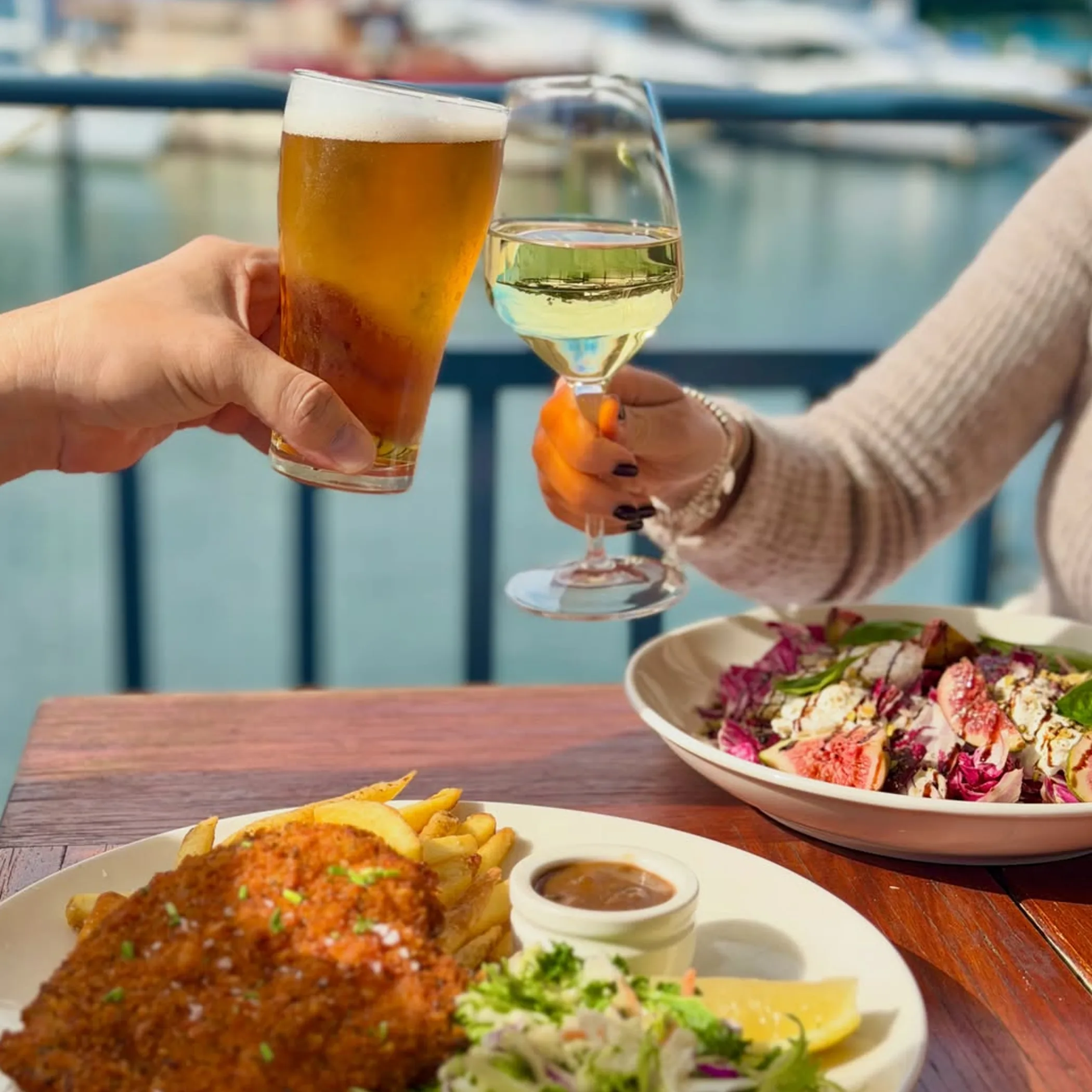 waterfront dining with food and drinks